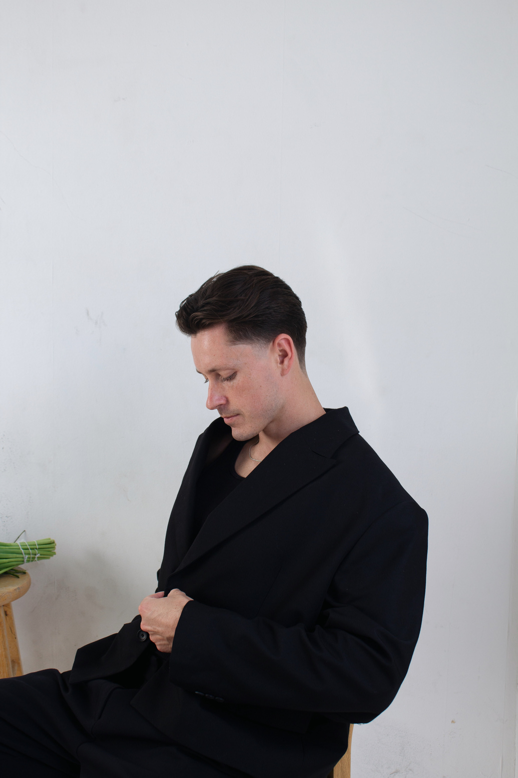Editorial portrait in a black tailored coat