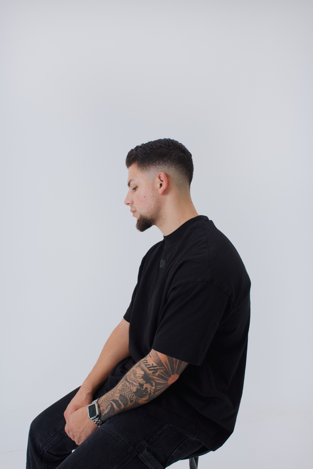 Seated studio portrait in all black
