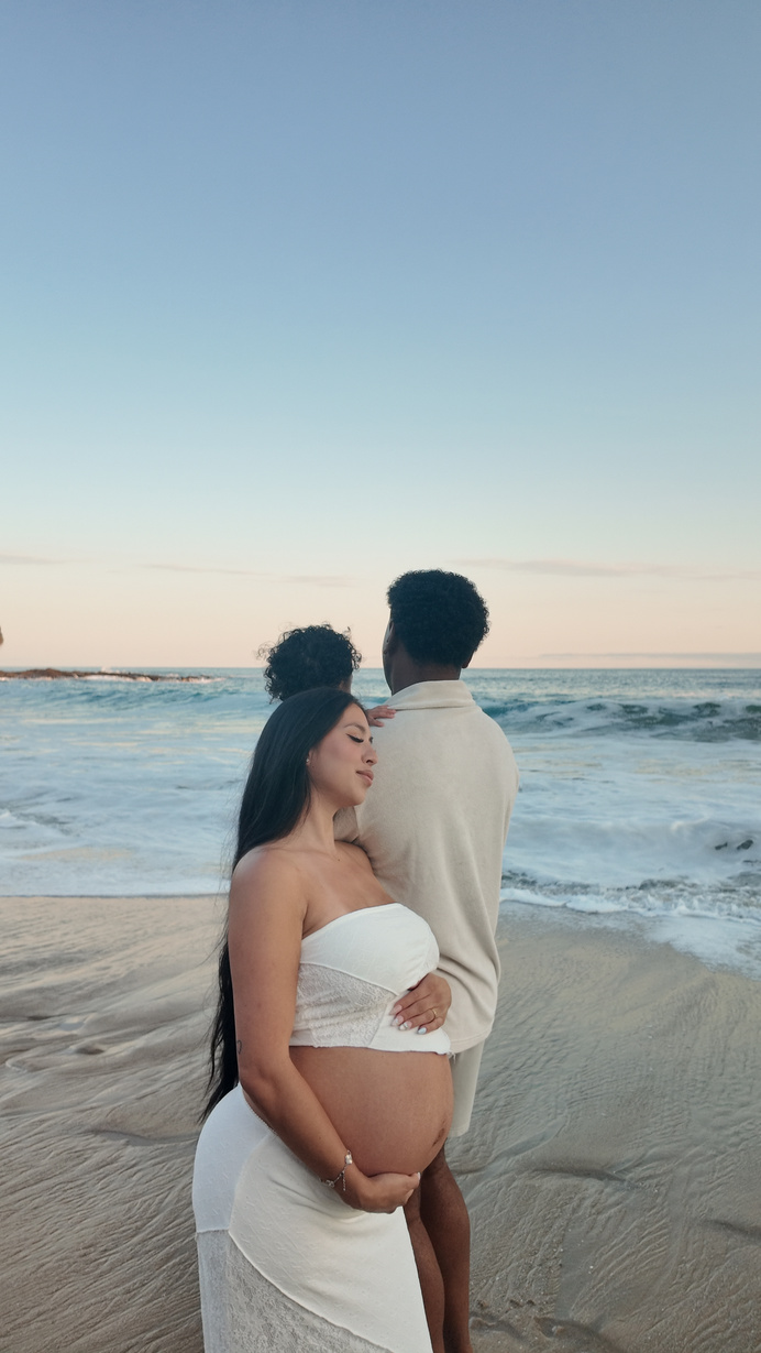 Couple embracing on the beach at sunset