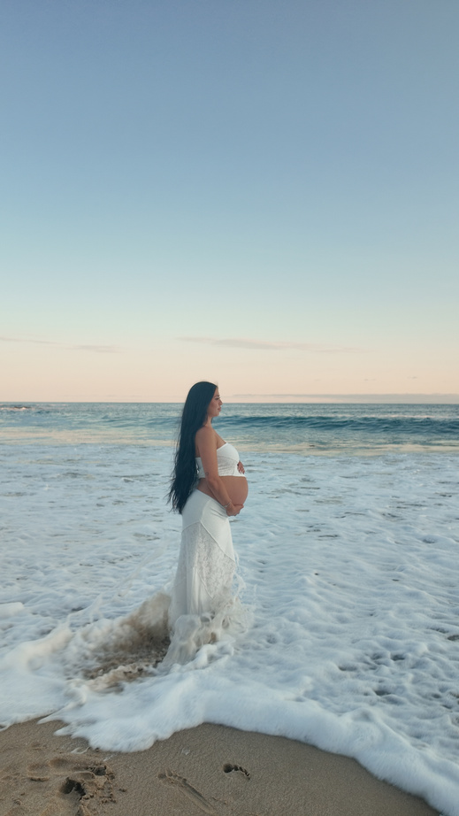 Portrait standing in the surf at dusk