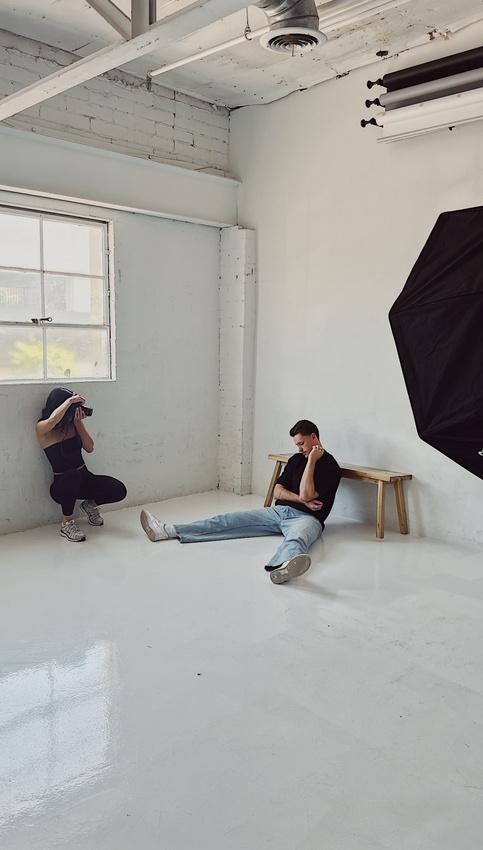 Marissa photographing a client inside a daylight studio